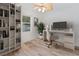 Bright office space with built-in shelving and hardwood floors at 11813 Holly Hock Dr, Lakewood Ranch, FL 34202