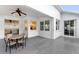 Covered patio with table and chairs, offering views of the kitchen and backyard at 11813 Holly Hock Dr, Lakewood Ranch, FL 34202