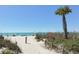 Sandy path to beach with palm trees at 1214 Gulf Blvd, Englewood, FL 34223