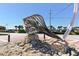 Modern metal beach art near road at 1214 Gulf Blvd, Englewood, FL 34223