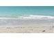 Ocean waves on sandy beach; soft waves and clear water at 1214 Gulf Blvd, Englewood, FL 34223