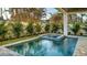 Inviting pool and spa area with lush landscaping at 1214 Gulf Blvd, Englewood, FL 34223