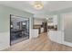 Open floor plan with the kitchen and dining area connected seamlessly through open doorways at 1219 Sleepy Hollow Rd, Venice, FL 34285