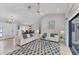 Spacious living room featuring a vaulted ceiling and an open layout to the dining room at 1219 Sleepy Hollow Rd, Venice, FL 34285