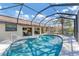 Sparkling screened pool with open views from the home's interior and an array of outside seating at 1219 Sleepy Hollow Rd, Venice, FL 34285