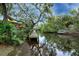 Private dock on the community waterway, offering direct access for kayaks and canoes at 1219 Sleepy Hollow Rd, Venice, FL 34285