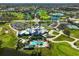 Community overview with golf course, clubhouse, tennis courts, and parking at 1227 Tuscany Blvd, Venice, FL 34292