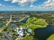Expansive aerial view of the community, showcasing the golf course and homes at 1227 Tuscany Blvd, Venice, FL 34292