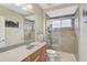 Clean bathroom with shower stall, toilet and updated vanity at 1227 Tuscany Blvd, Venice, FL 34292