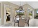 Bright breakfast nook with view of the pool and screened-in patio at 1227 Tuscany Blvd, Venice, FL 34292