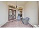 Inviting front porch with double doors and comfortable seating area at 1227 Tuscany Blvd, Venice, FL 34292