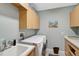 Convenient laundry room with washer, dryer, and storage cabinets at 1227 Tuscany Blvd, Venice, FL 34292