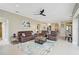Spacious living room with comfortable seating and view into kitchen area at 1227 Tuscany Blvd, Venice, FL 34292