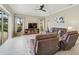 Spacious living room with comfortable seating and a view of the pool at 1227 Tuscany Blvd, Venice, FL 34292