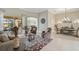 Spacious living room with a view to the dining area and access to the pool at 1227 Tuscany Blvd, Venice, FL 34292