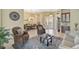 Open living area with comfortable seating and a view of the dining area at 1227 Tuscany Blvd, Venice, FL 34292