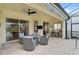 Outdoor patio with seating area, adjacent to the pool and main house at 1227 Tuscany Blvd, Venice, FL 34292