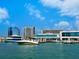 Waterfront view of a Sarasota marina with large boats docked near buildings at 1305 4Th St # 403B, Sarasota, FL 34236