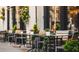 Outdoor patio seating area with cafe tables and flowers at 1305 4Th St # 403B, Sarasota, FL 34236