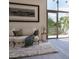 Spacious living room with large window and comfy seating area at 1305 4Th St # 502B, Sarasota, FL 34236