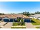Aerial view of a two-story home with tile roofs and two-car garages at 14369 Eagle Branch Dr, Nokomis, FL 34275