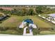 Community dog park with shaded seating area at 14369 Eagle Branch Dr, Nokomis, FL 34275