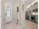 Bright and airy entryway with view into kitchen and hardwood floors at 14369 Eagle Branch Dr, Nokomis, FL 34275