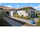 Well-maintained home exterior with brick pavers at 14369 Eagle Branch Dr, Nokomis, FL 34275