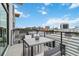 Private balcony with city view and small table and chairs at 1558 4Th St # 402, Sarasota, FL 34236