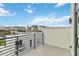 Private balcony with city views and metal railing at 1558 4Th St # 402, Sarasota, FL 34236