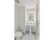 Clean bathroom with a walk-in shower and pedestal sink at 1558 4Th St # 402, Sarasota, FL 34236