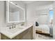 Bathroom with double vanity and bedroom view at 1558 4Th St # 402, Sarasota, FL 34236