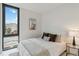 Bright bedroom with a queen-size bed and city view at 1558 4Th St # 402, Sarasota, FL 34236