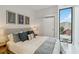 Modern bedroom with a queen bed and city view at 1558 4Th St # 402, Sarasota, FL 34236