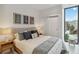 Modern bedroom with a queen bed and wood-framed accents at 1558 4Th St # 402, Sarasota, FL 34236