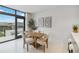 Modern dining area with wooden table and four cushioned chairs at 1558 4Th St # 402, Sarasota, FL 34236