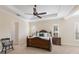 Bright bedroom with a queen-size bed and plenty of light at 16722 Collingtree Xing, Lakewood Ranch, FL 34202