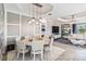 Bright dining room with round table and modern light fixture at 17731 Hickok Belt Loop, Bradenton, FL 34211