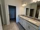 Double vanity bathroom with granite countertop and large walk-in shower at 18059 Cherished Loop, Bradenton, FL 34211