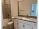 Bathroom with granite countertop, single sink, and tub shower combo at 18059 Cherished Loop, Bradenton, FL 34211