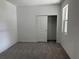 Bedroom with grey carpet, a closet, and neutral walls at 18059 Cherished Loop, Bradenton, FL 34211