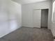 Bedroom with grey carpet, a closet, and neutral walls at 18059 Cherished Loop, Bradenton, FL 34211