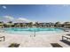 Large community pool with plenty of lounge chairs and umbrellas at 18059 Cherished Loop, Bradenton, FL 34211