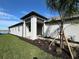 Modern home exterior with covered entryway and landscaped walkway at 18059 Cherished Loop, Bradenton, FL 34211