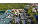 Community center with tennis courts, pool, and lush landscaping at 206 Bella Vista Ter # 29B, North Venice, FL 34275