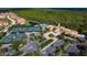Community center with tennis courts, pool, and lush landscaping at 206 Bella Vista Ter # 29B, North Venice, FL 34275