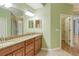 Double vanity bathroom with granite countertop at 206 Bella Vista Ter # 29B, North Venice, FL 34275