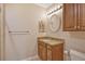 Bathroom with granite countertop vanity and updated fixtures at 206 Bella Vista Ter # 29B, Nokomis, FL 34275