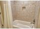 Clean bathroom with tiled shower/tub combination at 206 Bella Vista Ter # 29B, Nokomis, FL 34275