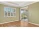 Bright bedroom, wood flooring, access to patio at 206 Bella Vista Ter # 29B, North Venice, FL 34275